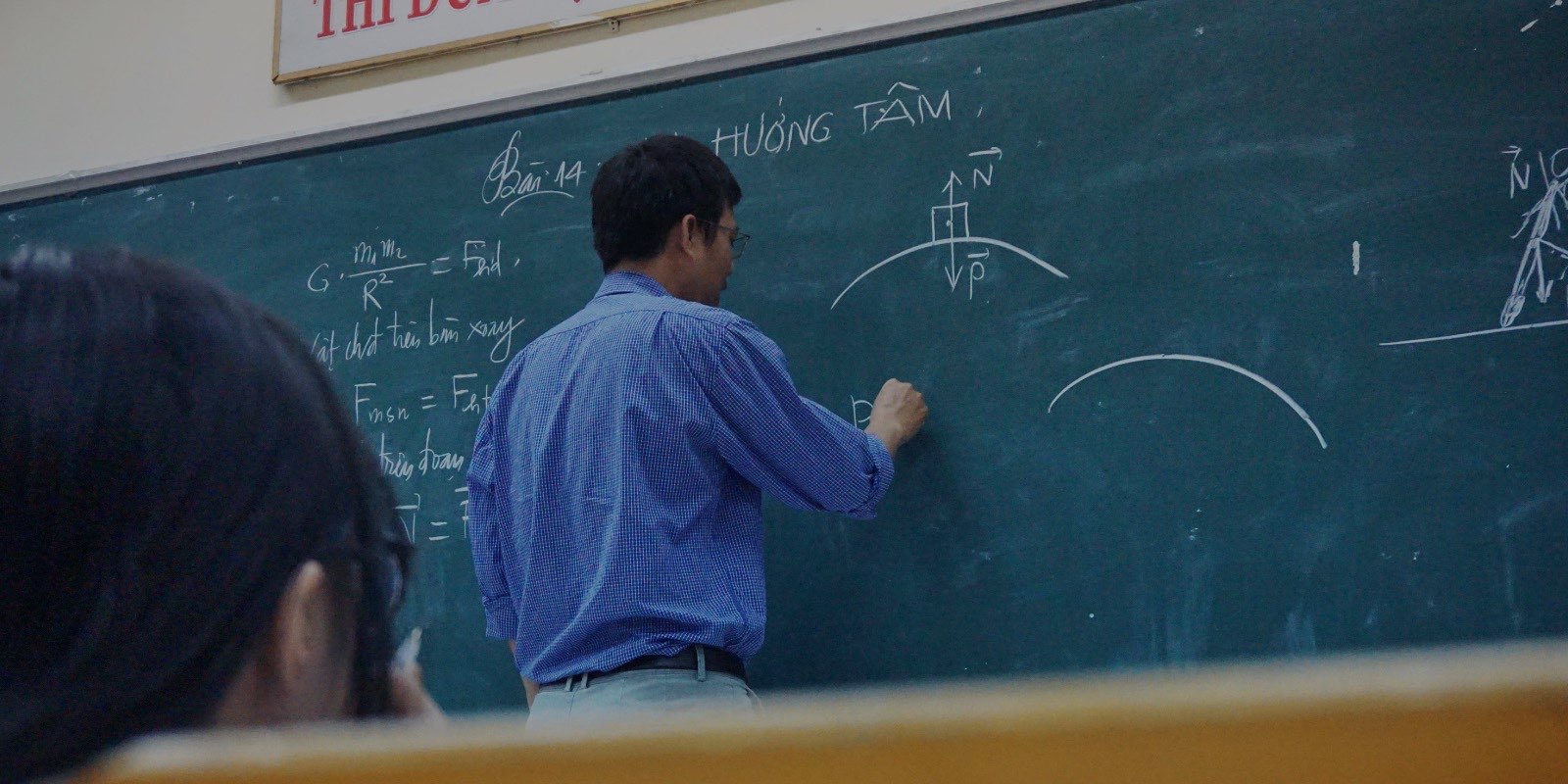Teacher at a blackboard