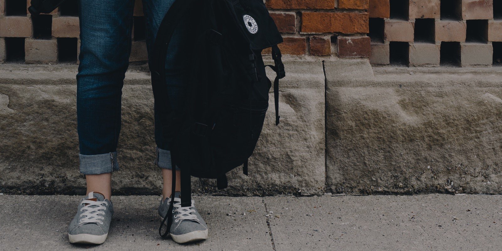 Student's feet with backpack
